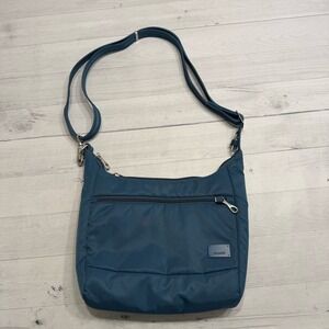 Pacsafe Antitheft Crossbody bag Citysafe CS series in Tidal Teal yellow lining